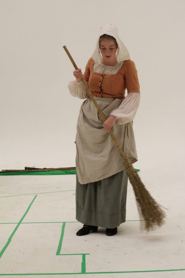 woman sweeping on a vr set